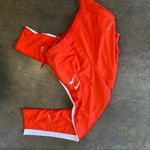NIKE orange Stacked Swoosh pants